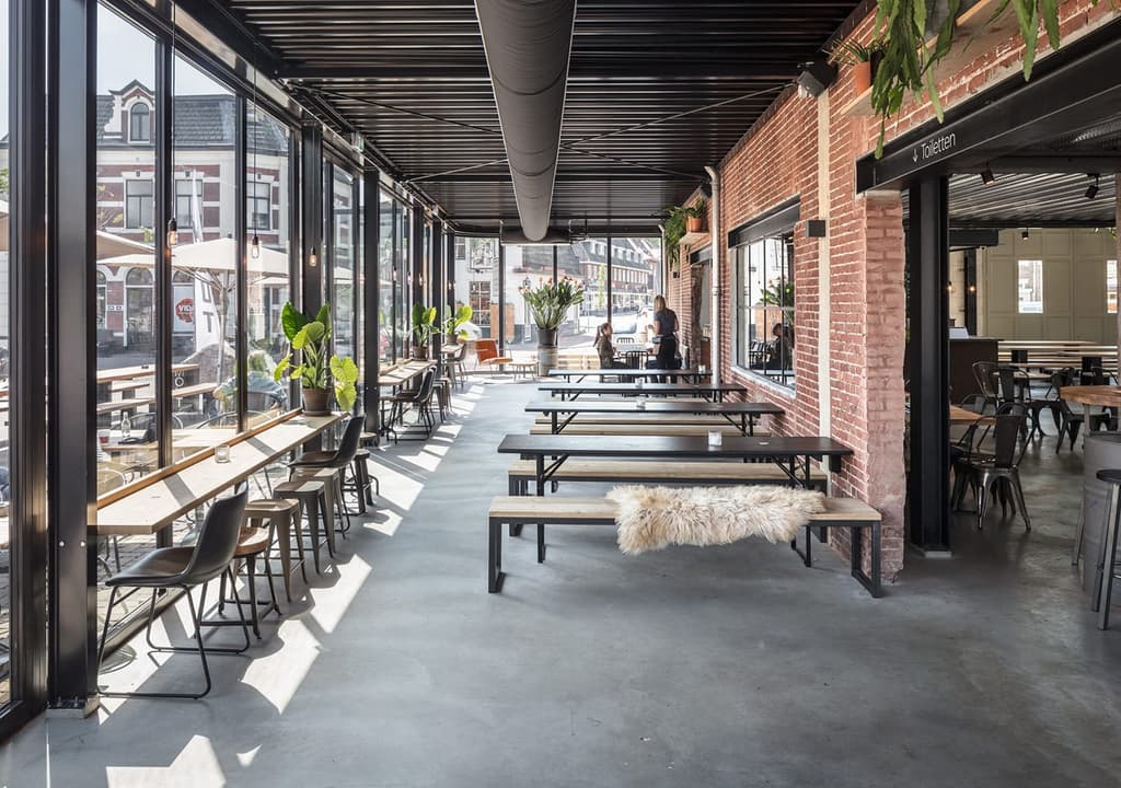 Former garage is reborn as Mout Foodhall in Holland’s Hilversum
