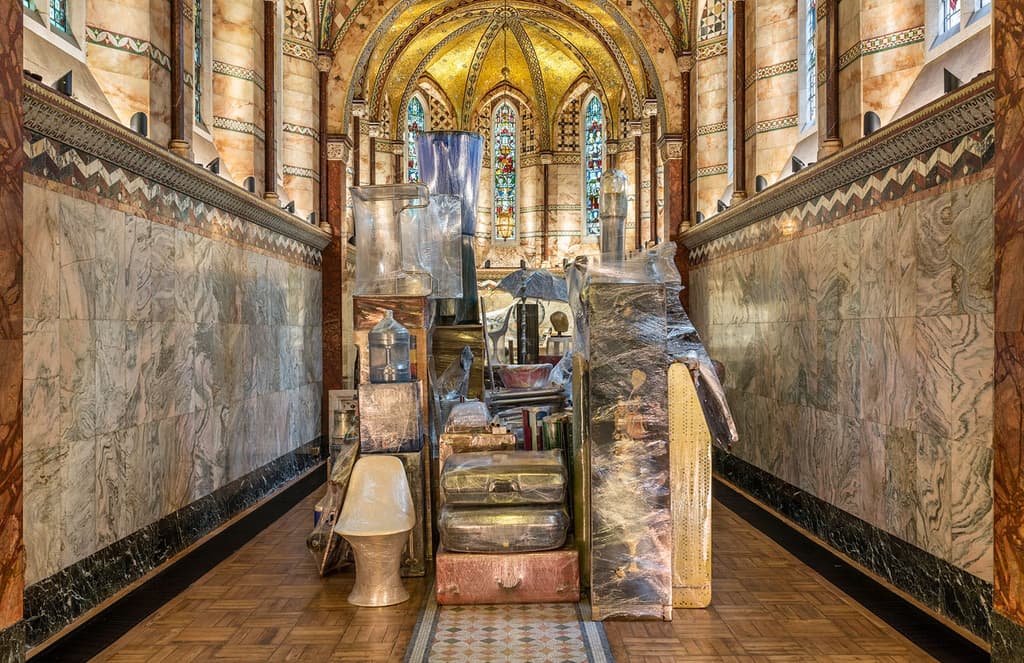 Artist fills London chapel with 200 shrink-wrapped household objects