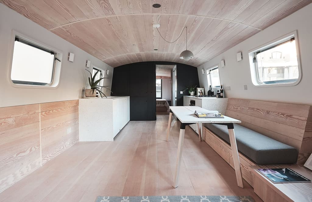 Inside a minimalist houseboat by 31/44 Architects