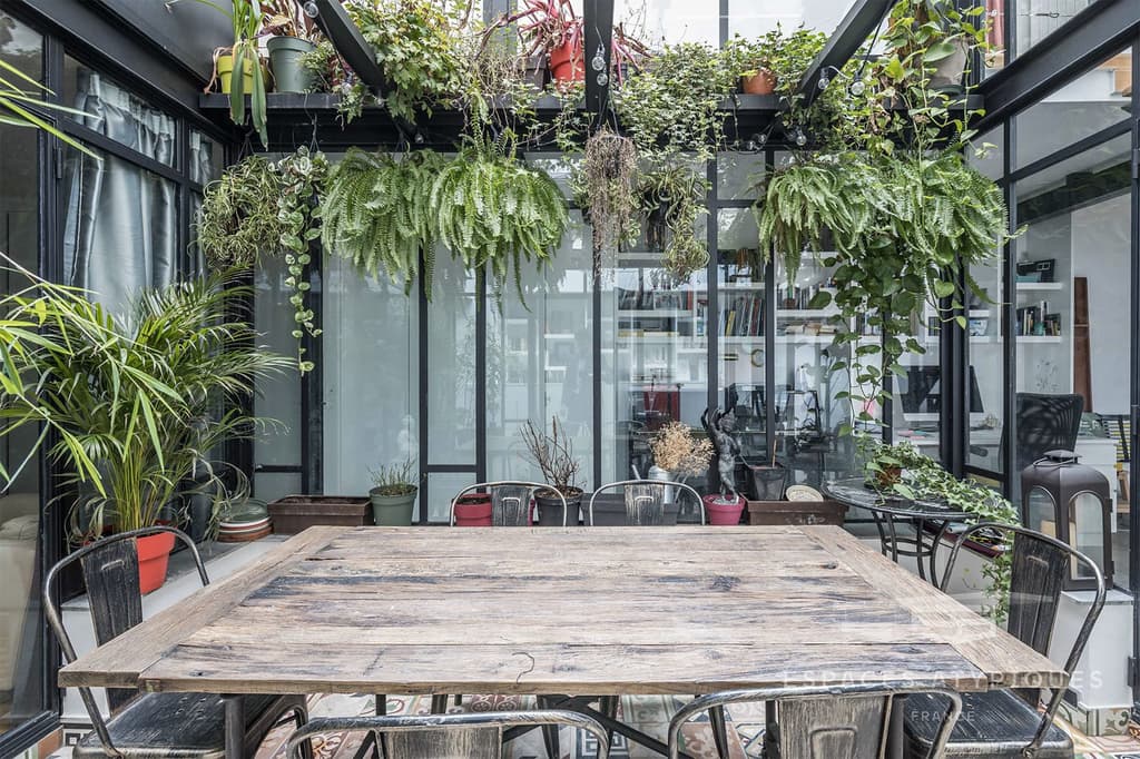 A glass-covered dining terrace