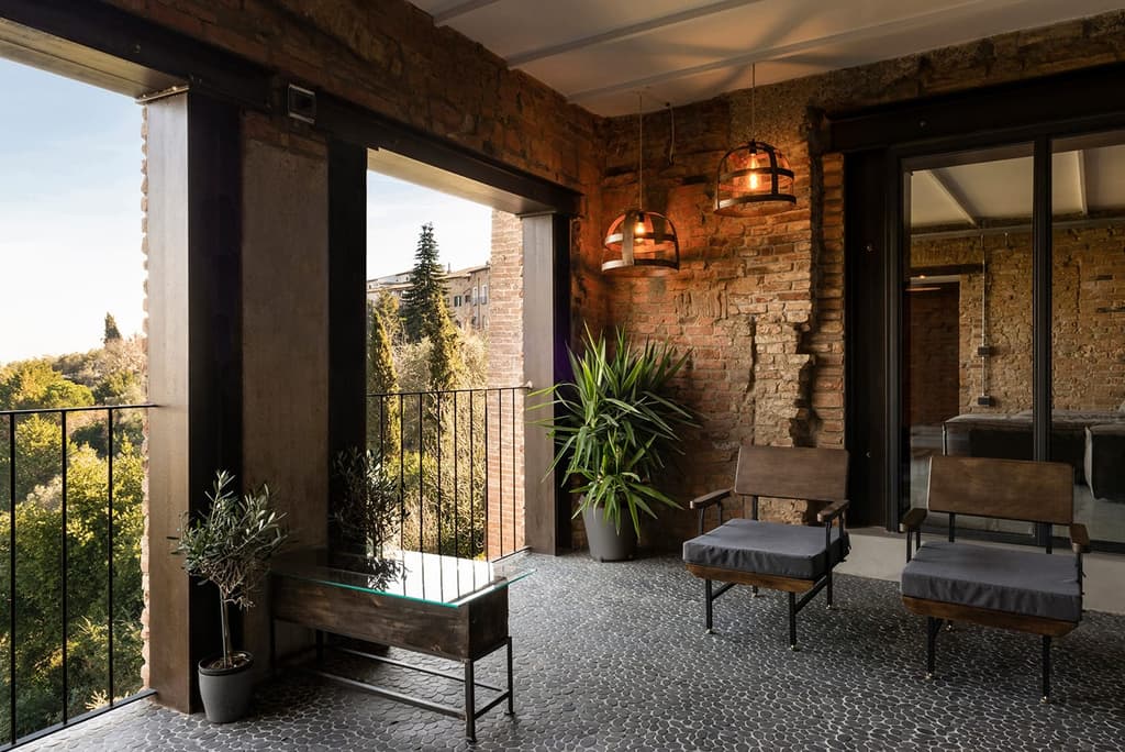 Pebbled floors and red brick walls are on show in the shaded balcony area