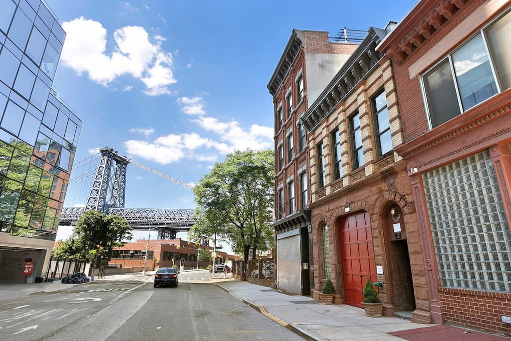 converted firehoue for sale: the terracotta exterior facade has been refurbished as part of the building's conversion for residential use