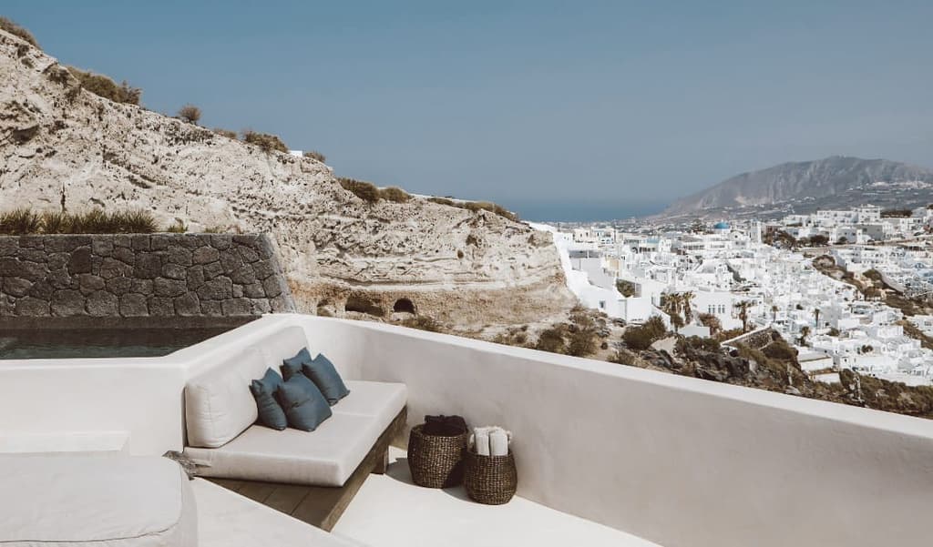 Villa Vora is an angular retreat carved into a volcanic clifftop in Santorini