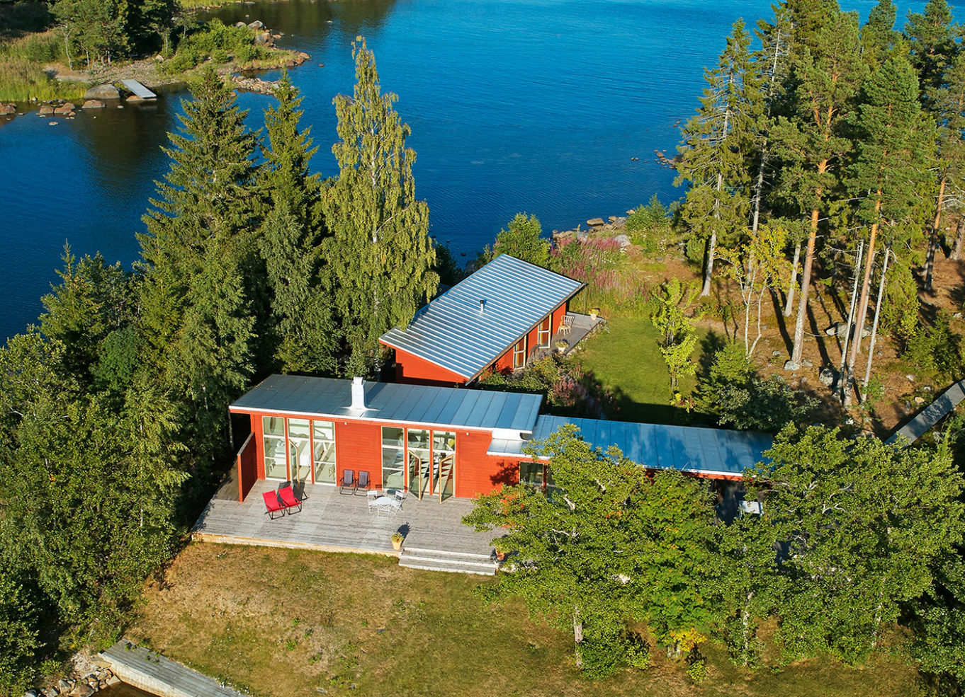 A private Swedish island with striking red cabin home could be yours