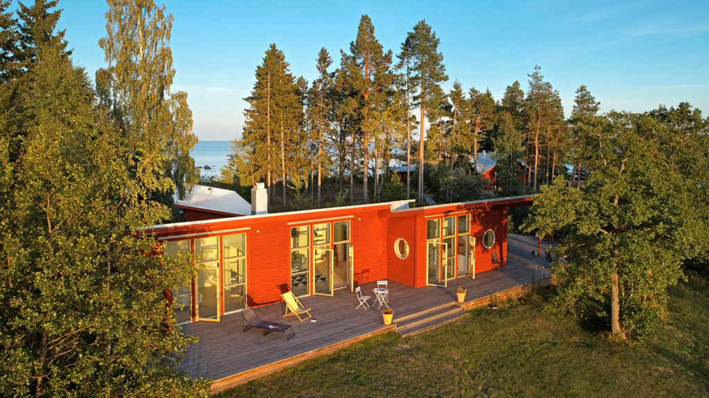 A private Swedish island with striking red cabin home could be yours