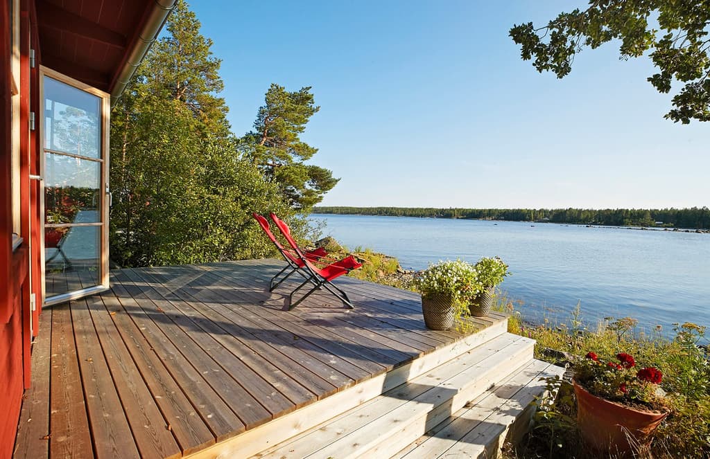A private Swedish island with striking red cabin home could be yours