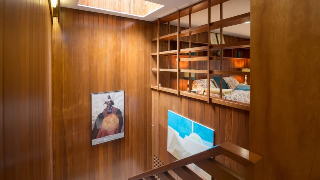 Warm wood panelling is used throughout the Tivadar and Dorothy Balogh House and the stairwell is illuminated by a rectangular skylight