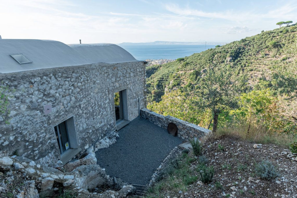 A converted olive oil factory with raw interiors is for sale in Italy