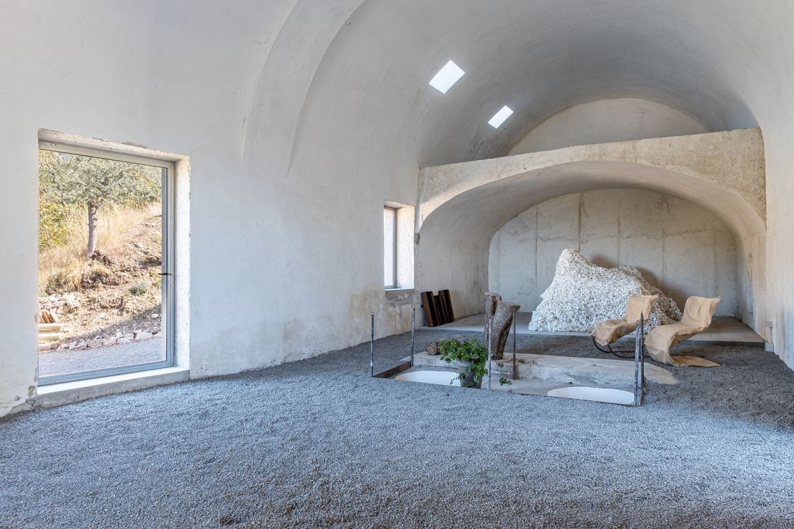 A converted olive oil factory with raw interiors is for sale in Italy