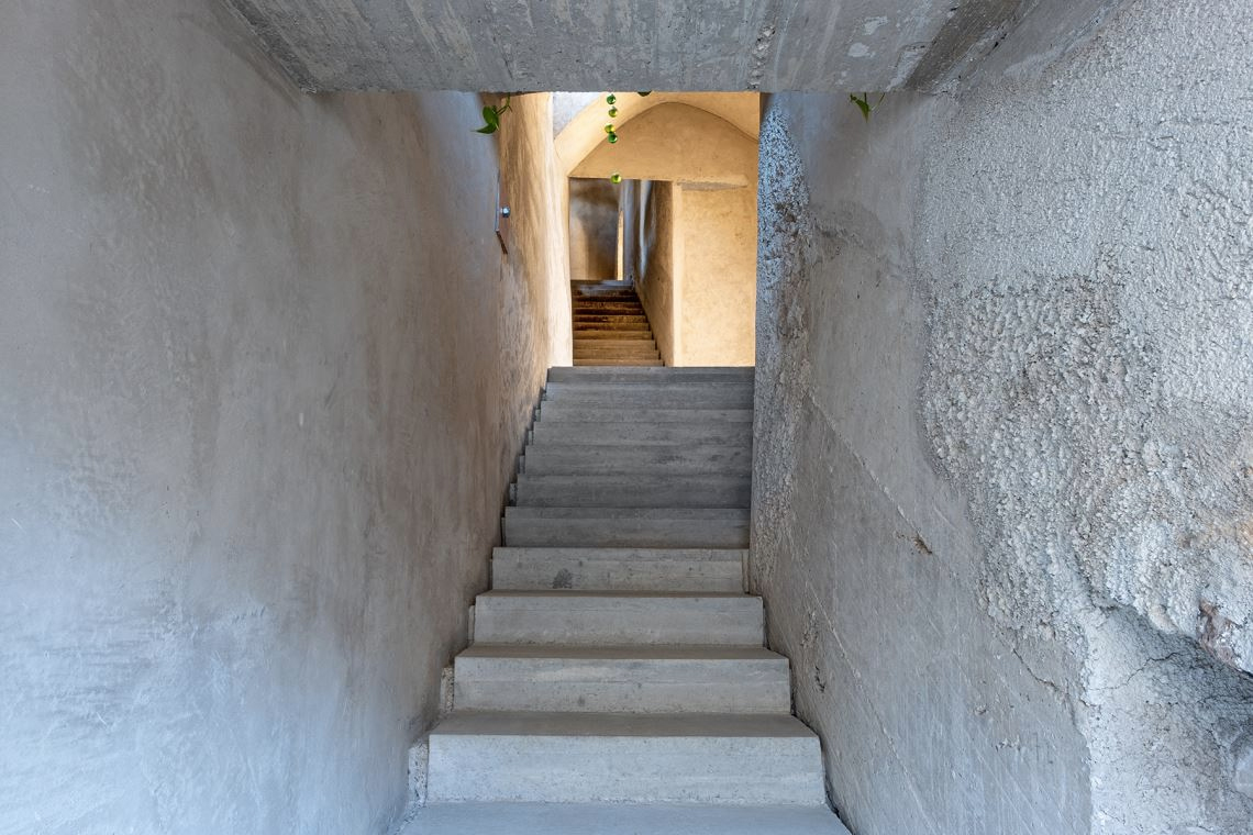 A converted olive oil factory with raw interiors is for sale in Italy