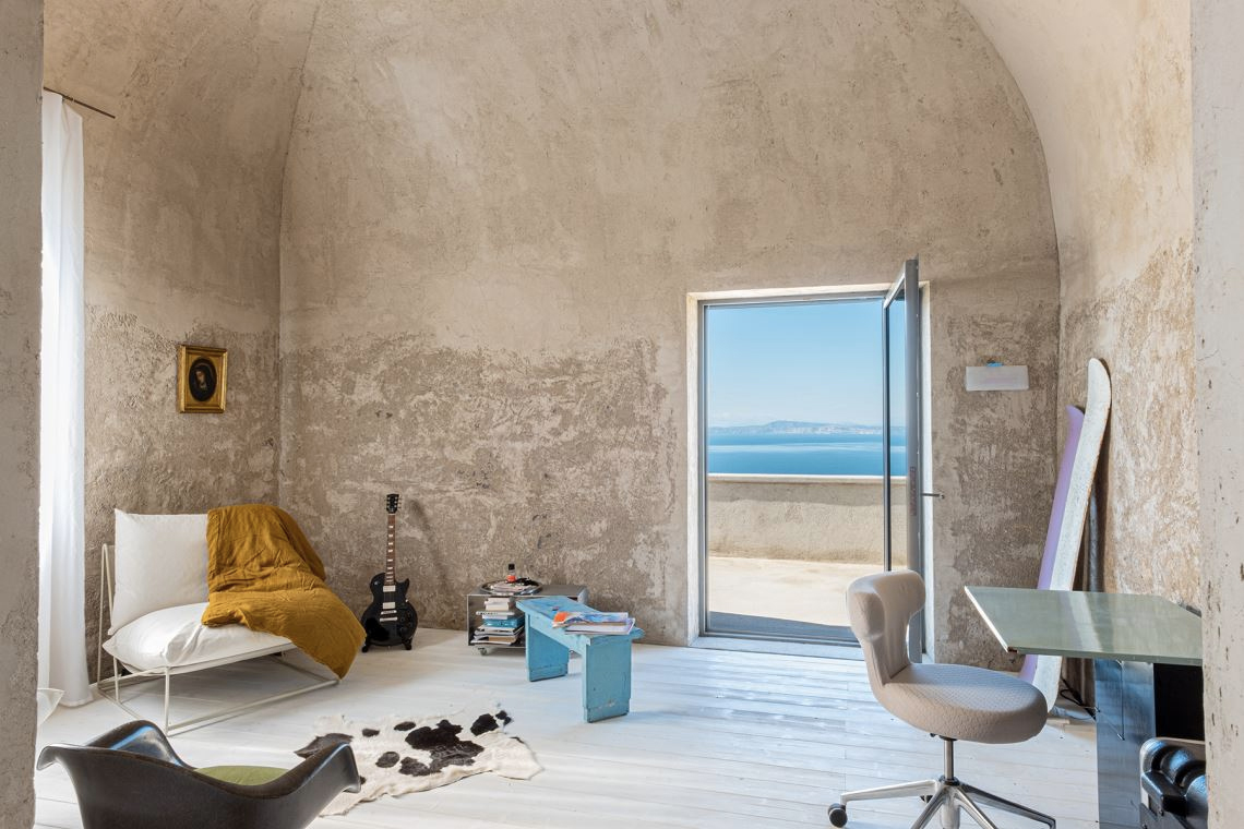 A converted olive oil factory with raw interiors is for sale in Italy