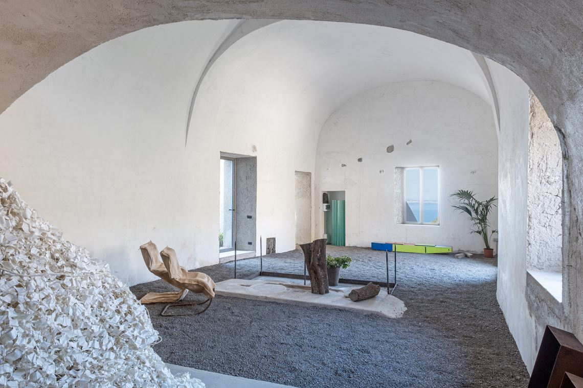 A converted olive oil factory with raw interiors is for sale in Italy