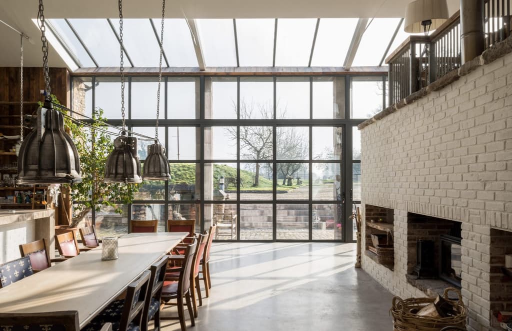 Glass walls illuminate this epic barn conversion in Frome, Somerset
