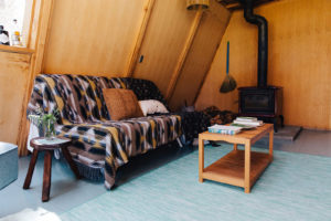 Far Meadow High Sierra compound for sale: shot of the A-frame cabin's living room