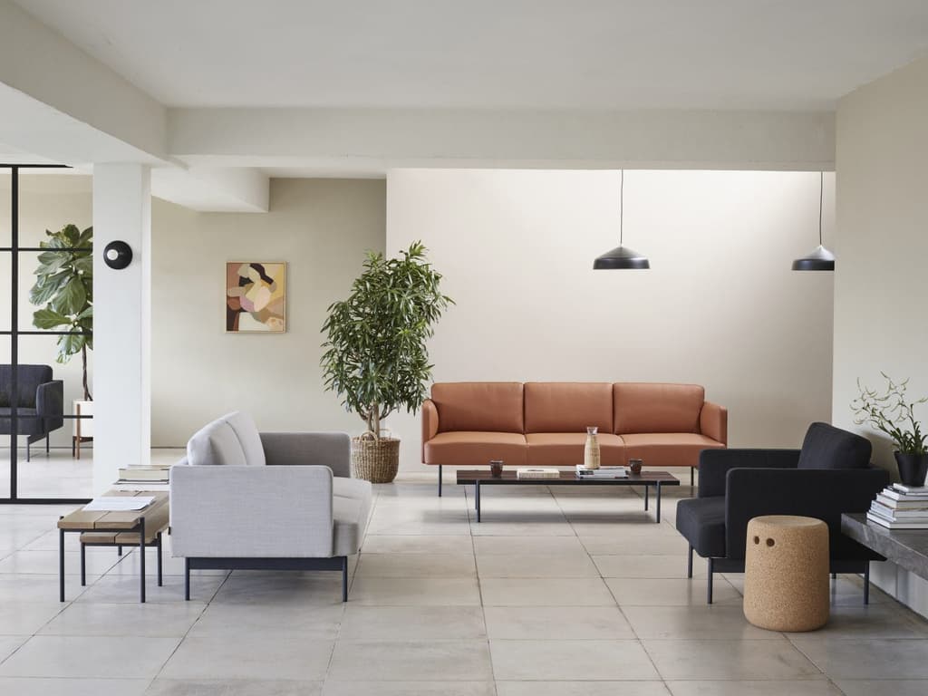 Draft is a compact sofa and table collection designed for workplace, hospitality and domestic environments