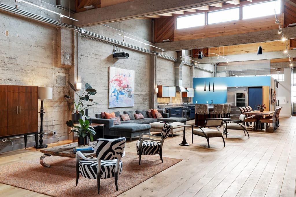 Stacked shipping containers sit inside this sprawling warehouse loft in San Francisco's Fillmore District, juxtaposing industrial brick bones with rugged steel.