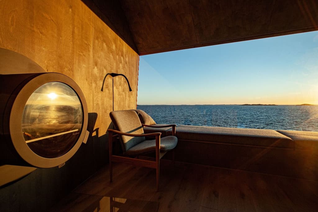 Flokehyttene cabins perch on a rocky headland in western Norway