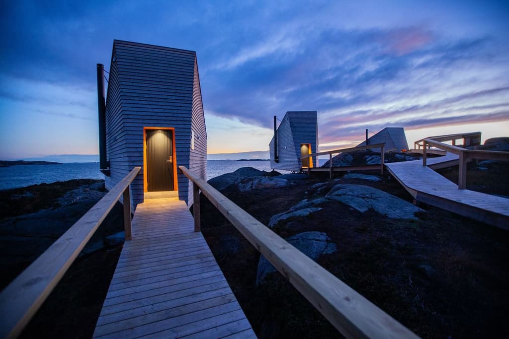 Flokehyttene cabins perch on a rocky headland in western Norway