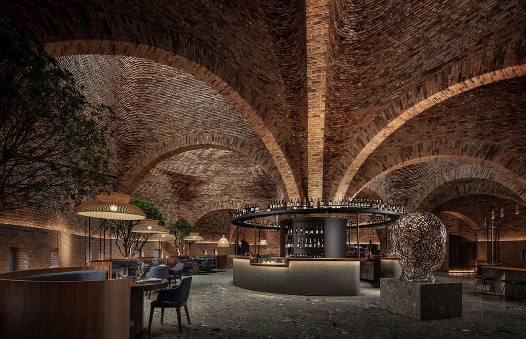 Mile City’s 50% Cloud stands out against the forested backdrop, thanks to its unusual funnel-shaped red brick exterior