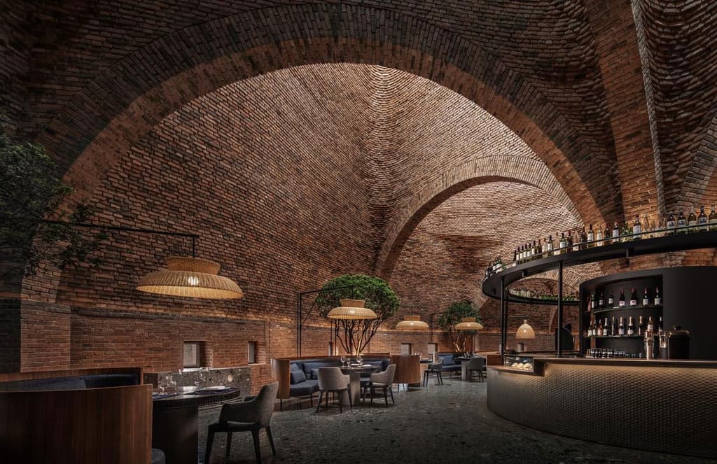Mile City’s 50% Cloud stands out against the forested backdrop, thanks to its unusual funnel-shaped red brick exterior