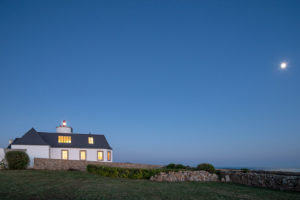 A converted semaphore station and lighthouse perches on the rocky Breton coast