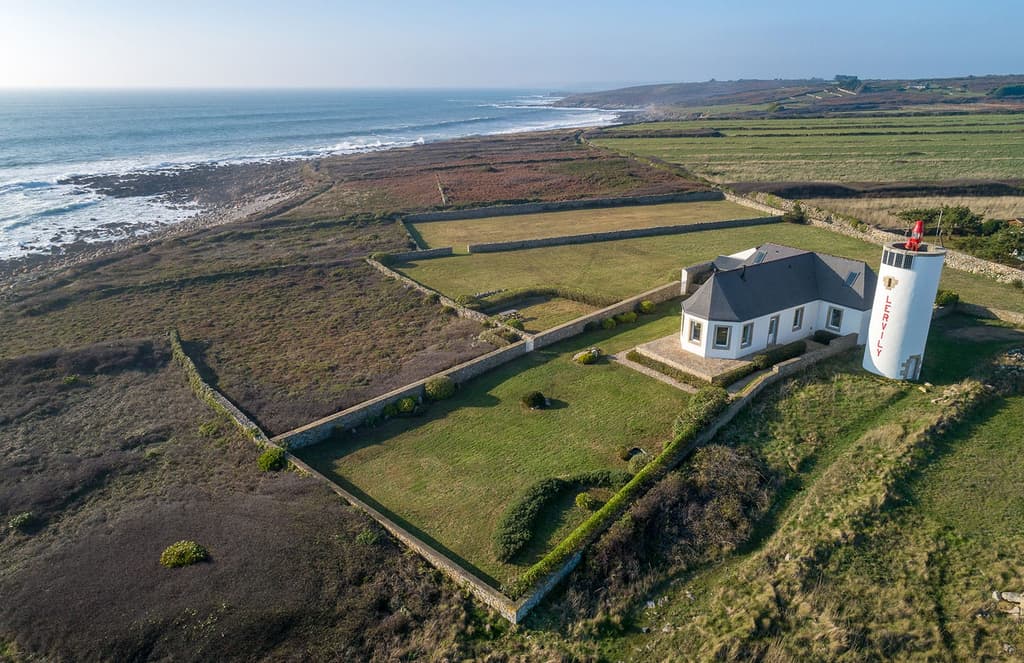 A converted semaphore station perches on the rocky Breton coast