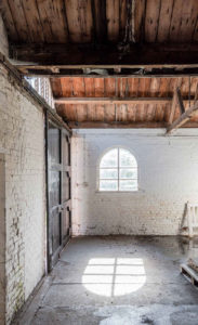 The red brick building sits on the banks of the River Colne and is a vacant shell that’s already been stripped back to its bones