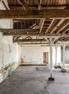 The red brick building sits on the banks of the River Colne and is a vacant shell that’s already been stripped back to its bones