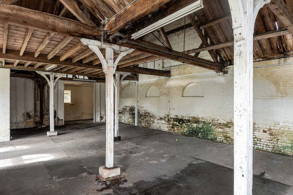 The red brick building sits on the banks of the River Colne and is a vacant shell that’s already been stripped back to its bones