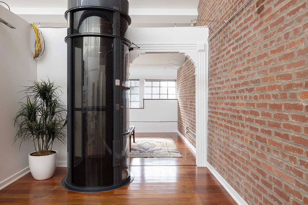 Arched doorways and floating walls help divide the apartment while retaining its soaring height