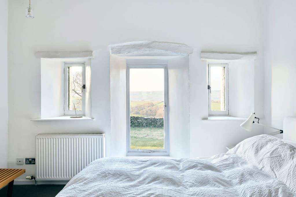 Bedrooms are a minimalist's dream, with whitewashed walls and ceilings and hardwood floors.