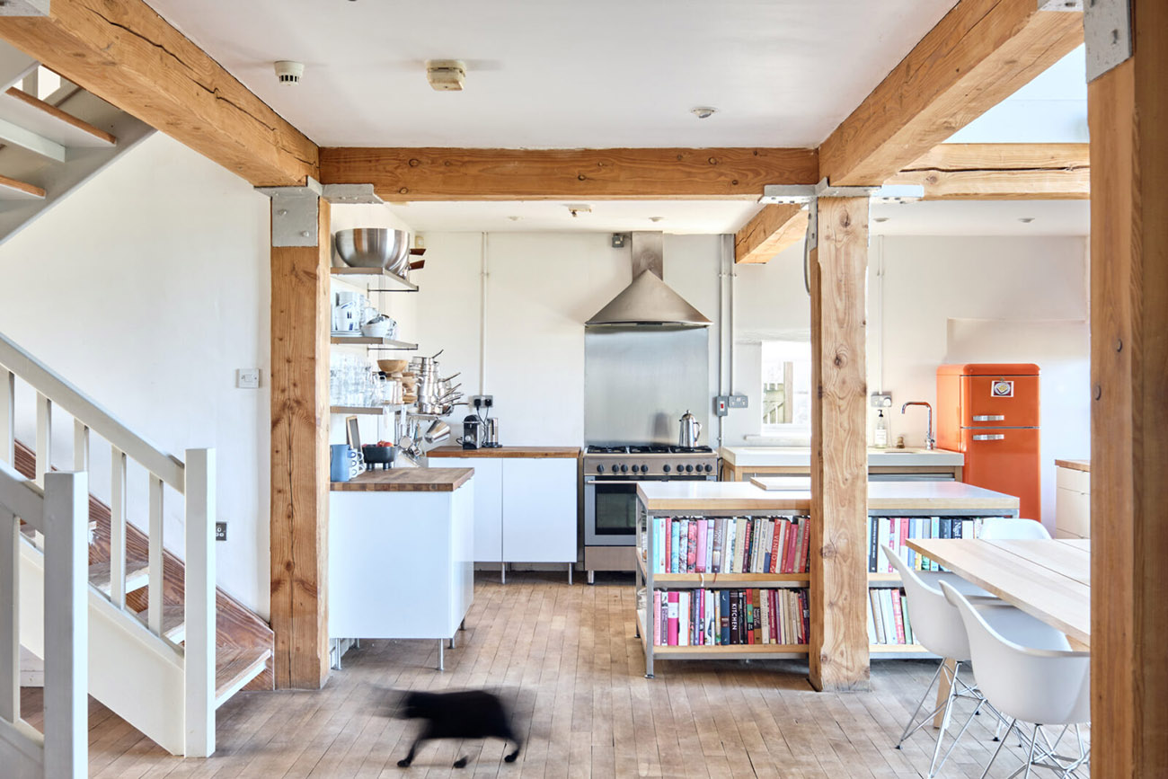 The building's been restored, with rustic Douglas fir beams exposed across the interior