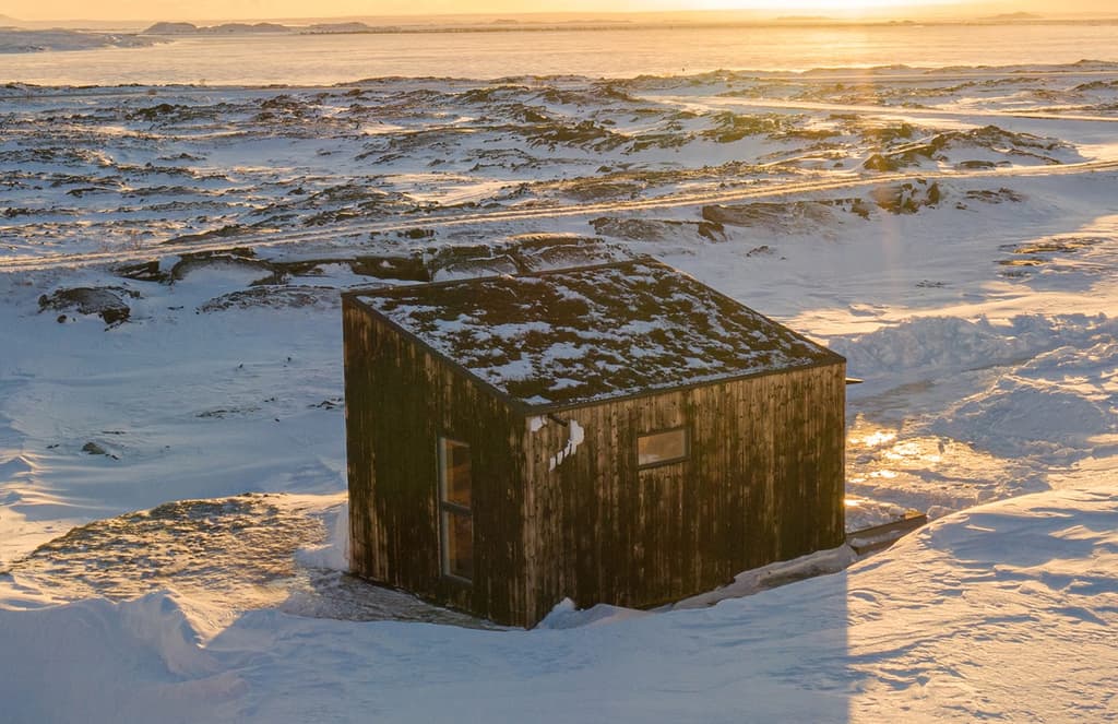 Studio Heima builds a charred cabin on an Icelandic lava field