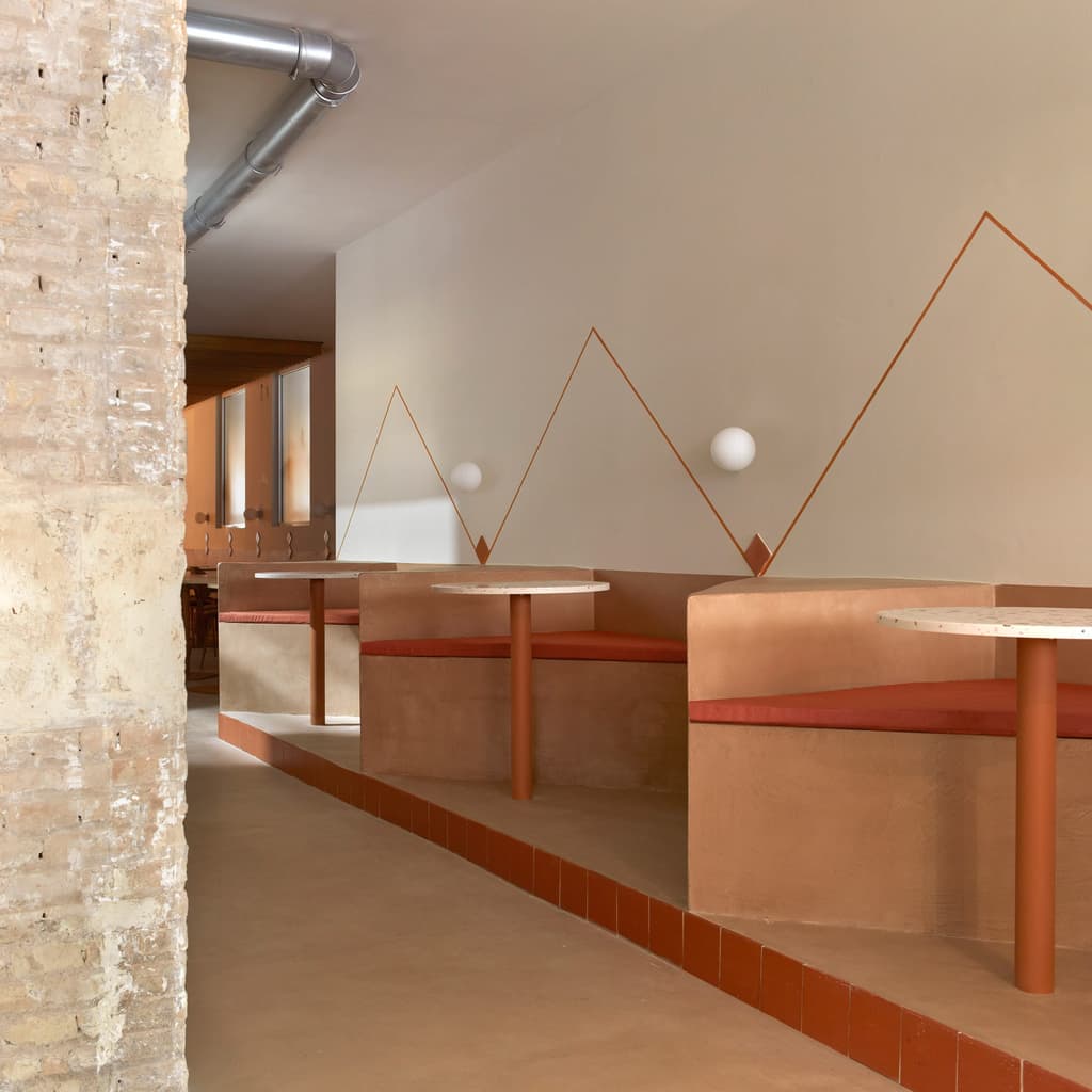 Wood and terracotta contrast rough exposed brick and terrazzo table tops inside BeGood salad bar, Valencia