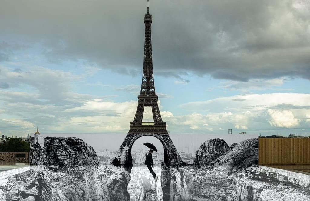 The earth opens up beneath the Eiffel Tower in JR’s new installation