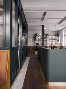 Fluted glass around the kitchen recalls the bank manager's office
