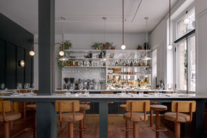 Sunlight falls on glimpses of the original wooden mouldings and vault door at this bank turned bistro on Québec’s Rue Saint-Joseph.