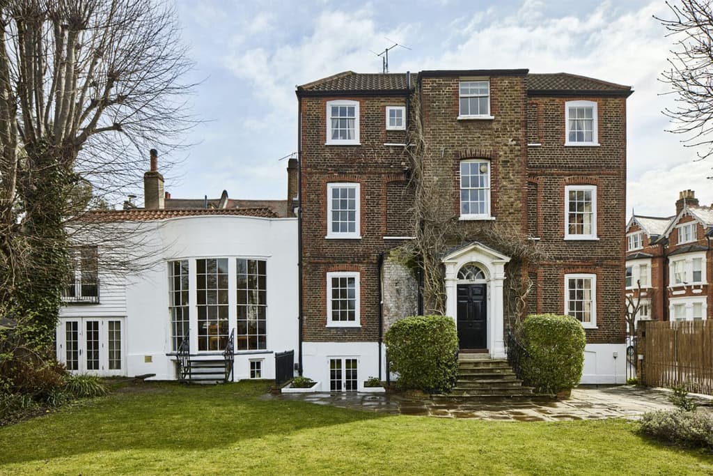 The exterior of the property - note the white addition is the regency period ballroom, now a family room