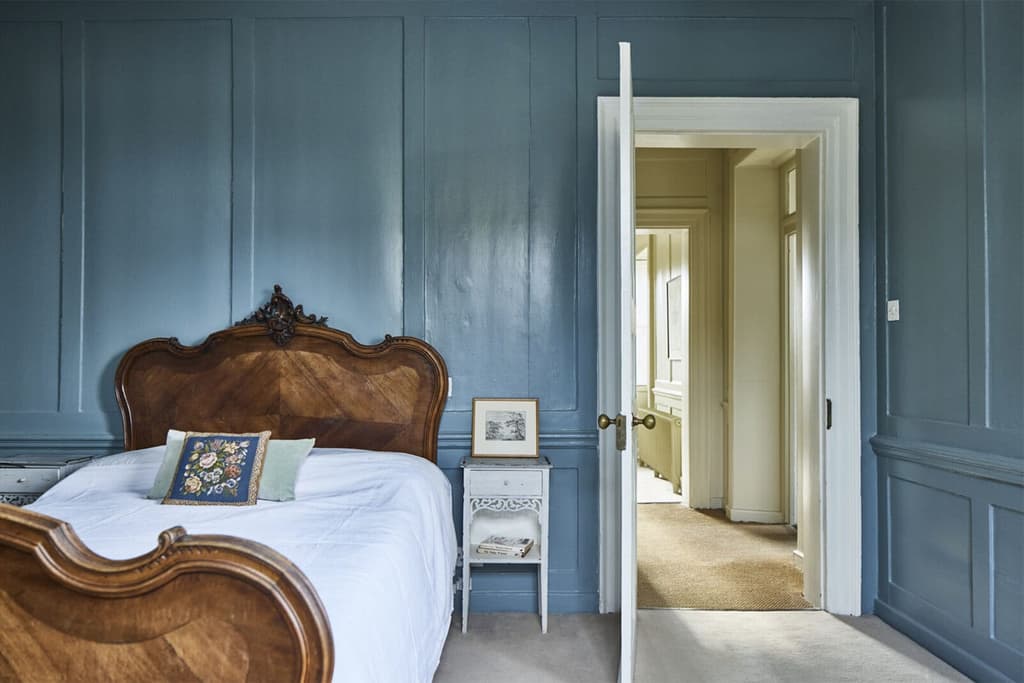Painted panelling and period furnishings recall the Regency era
