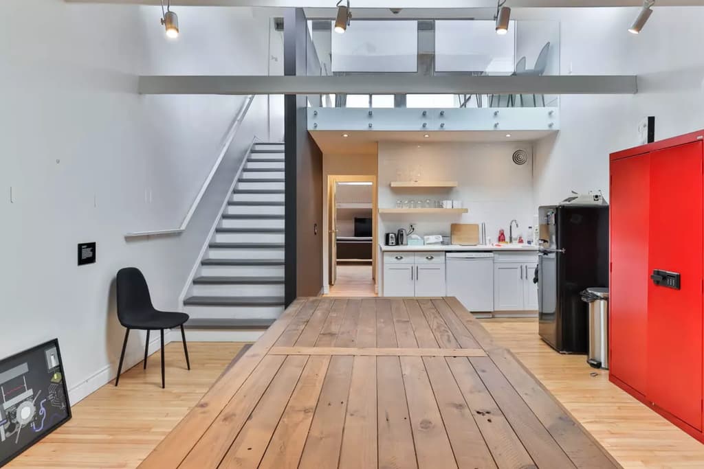 There are six live/work units inside the building as well as the climbing gym. According to the listing and Blog TO post, all are leased so the building is for sale as a commercial investment.