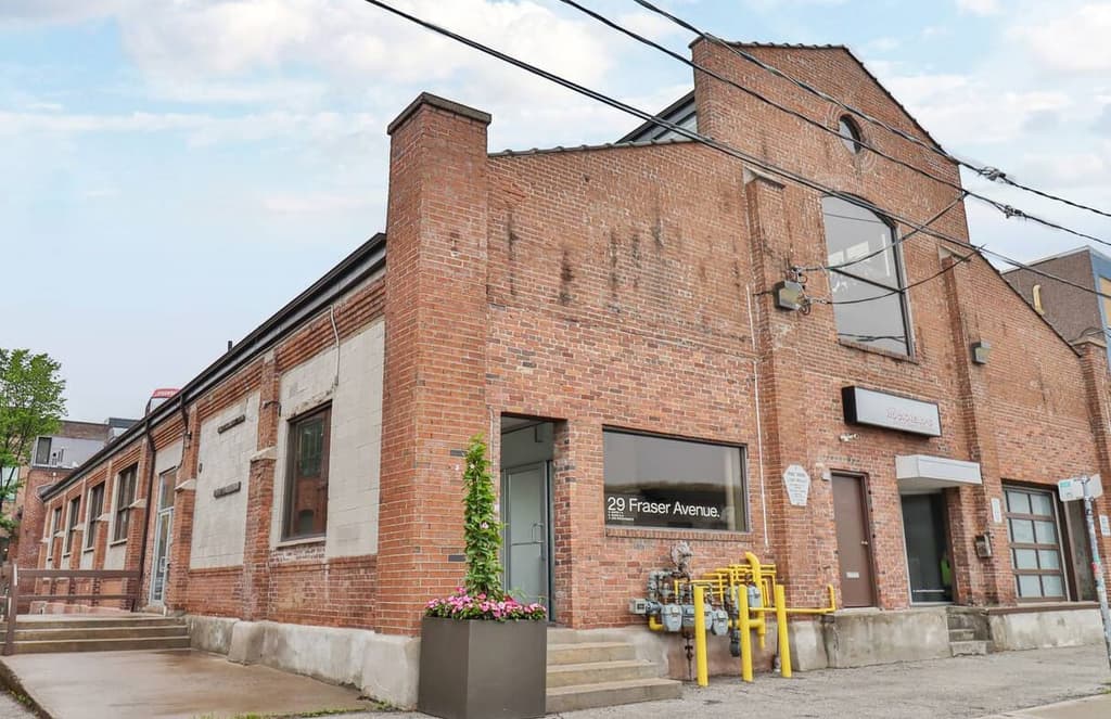 Toronto live/work building is for sale with an indoor rock climbing gym inside