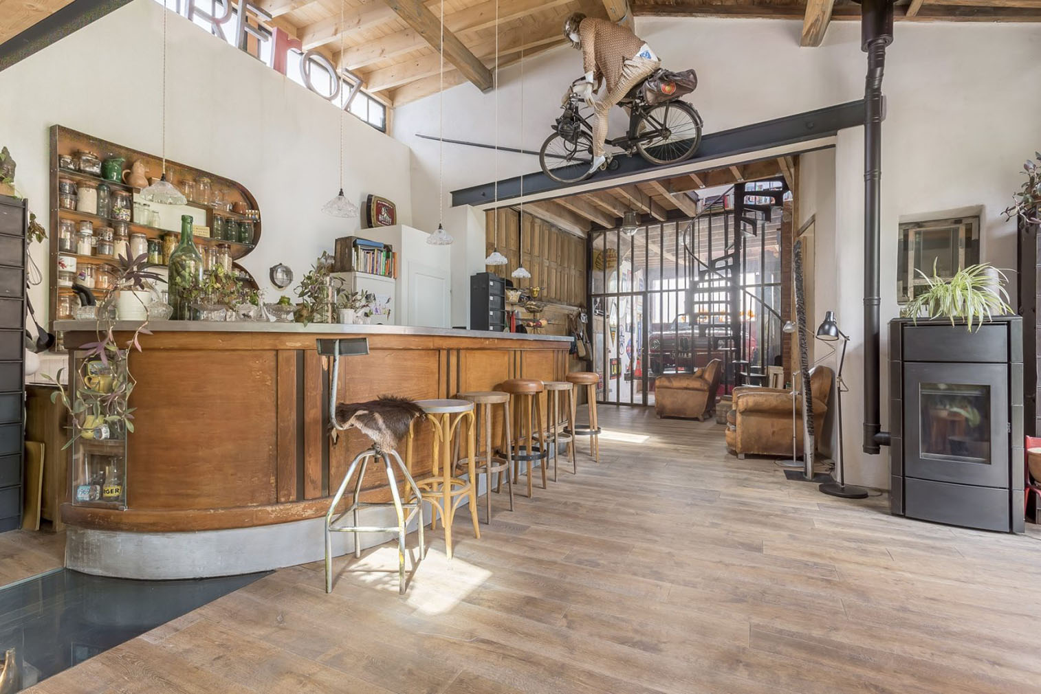 The building's quirky personality shines through as part of its refurbishment: Steel beams, rafters and clerestory windows are some of the original features