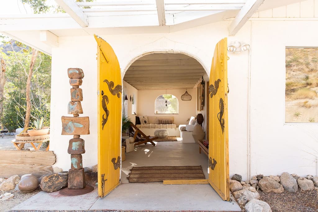 Arched doors peek into the adobe dwelling