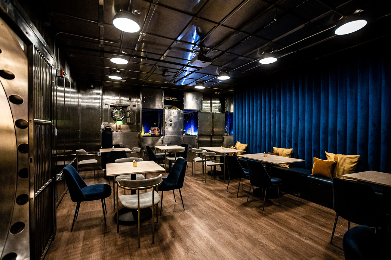 Greens and blues create a contemporary colour contrast to the buffed steel and terrazzo elements of Shelby's interiors