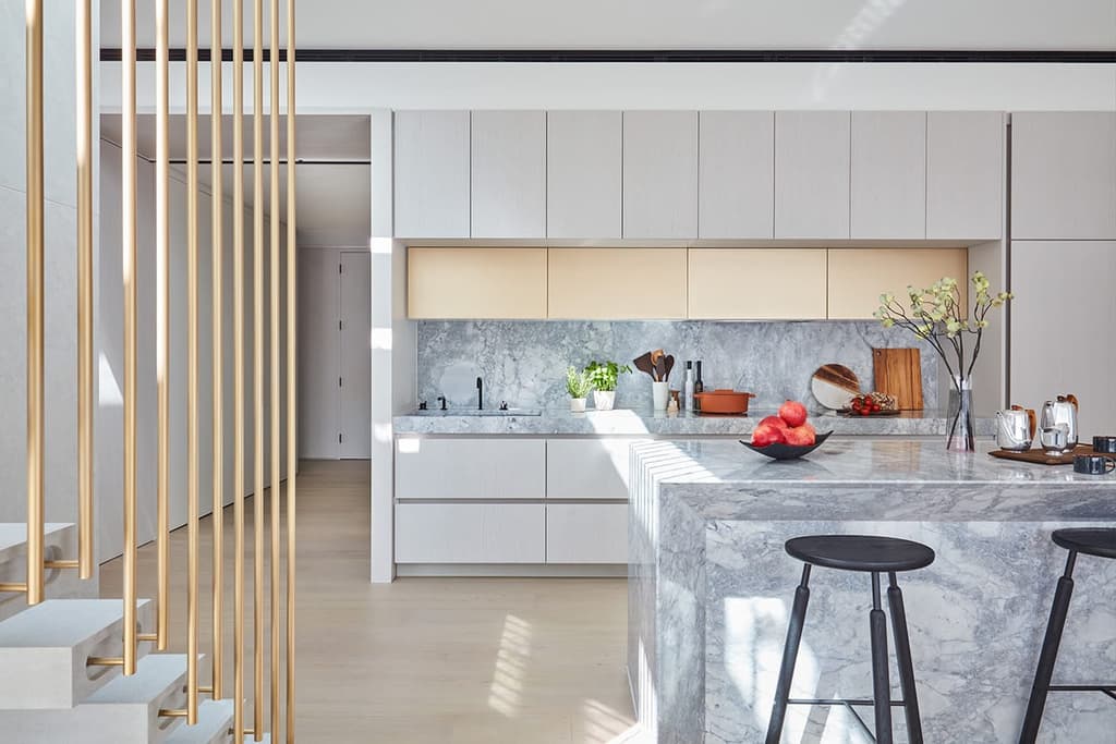 Stone plays a huge role in the kitchen, continuing the nature-inspired material palette