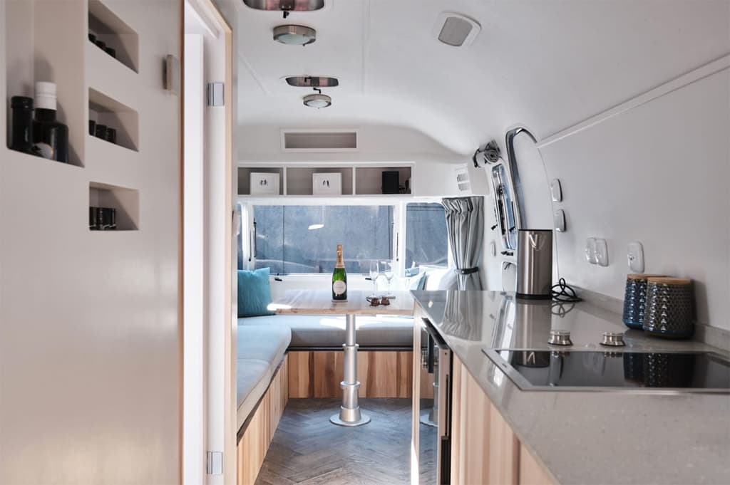 Kitchen cabinetry is made with poplar timber and terrazzo tops