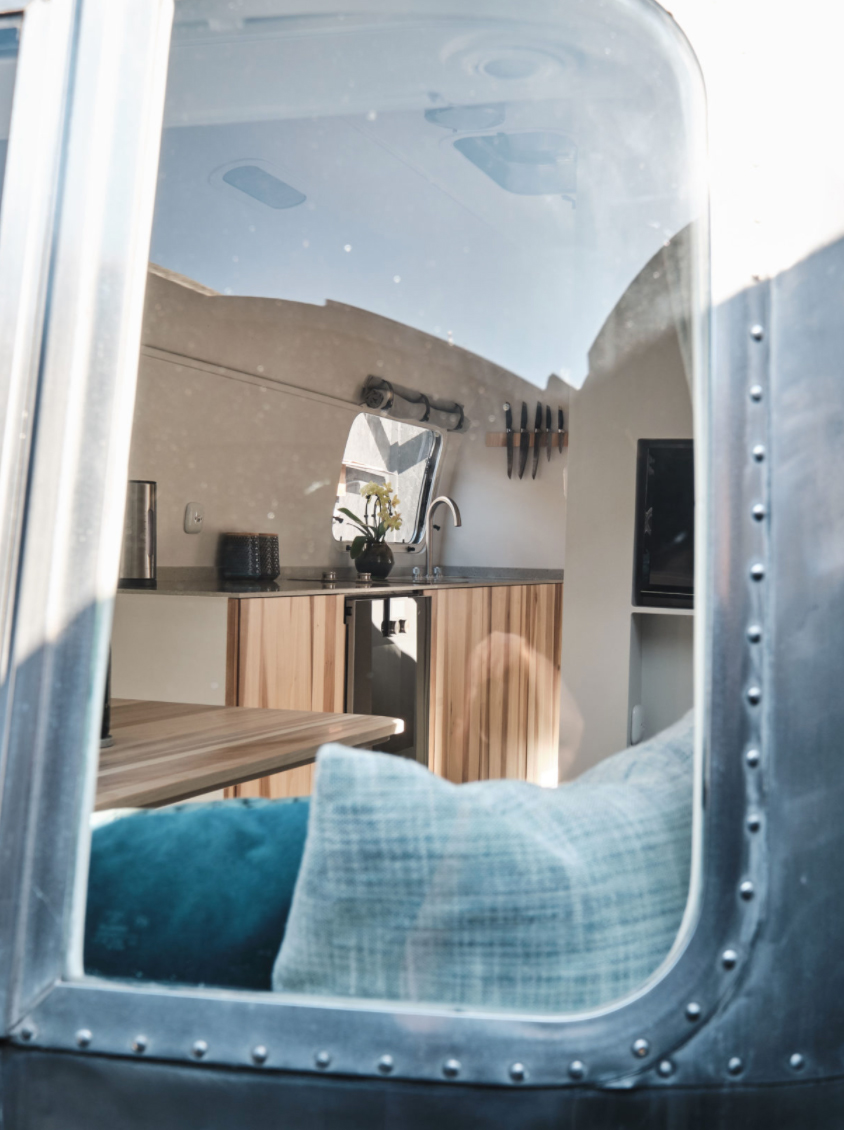 ​​Gear operated windows and touch-control steps are original, as is the Zip Dee awning.