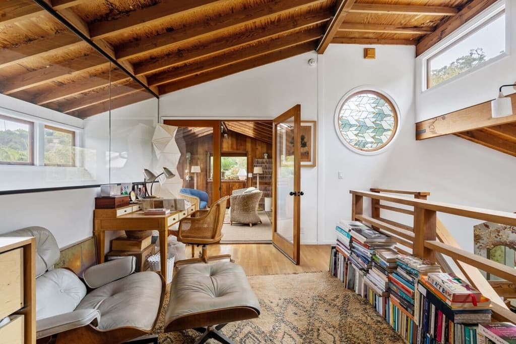 The landing houses a reading nook with clerestory windows