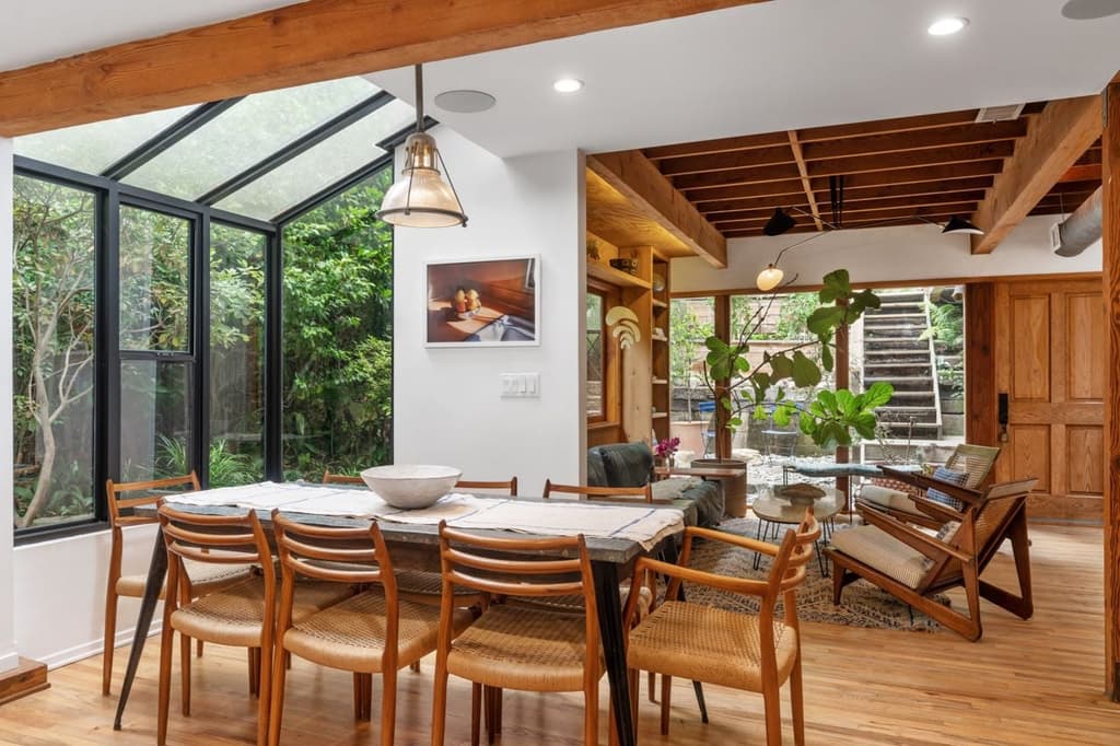 Swathes of glass amplifies light across the property while providing views of the surrounding woodland plot