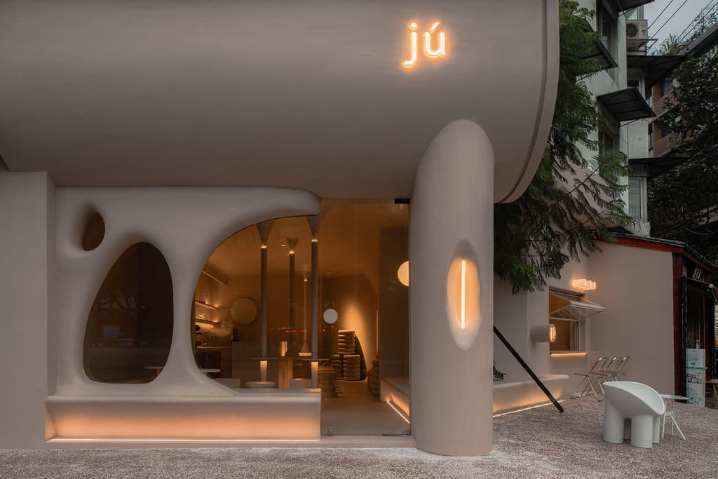 Oval window openings and pillars evoke an ancient troglodyte dwelling